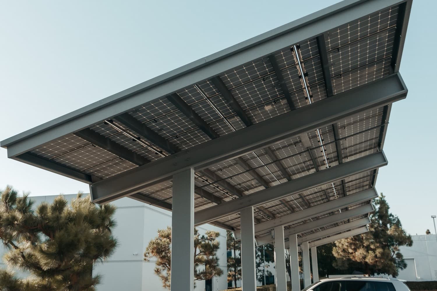 Solar carport canopy shading a commercial parking lot