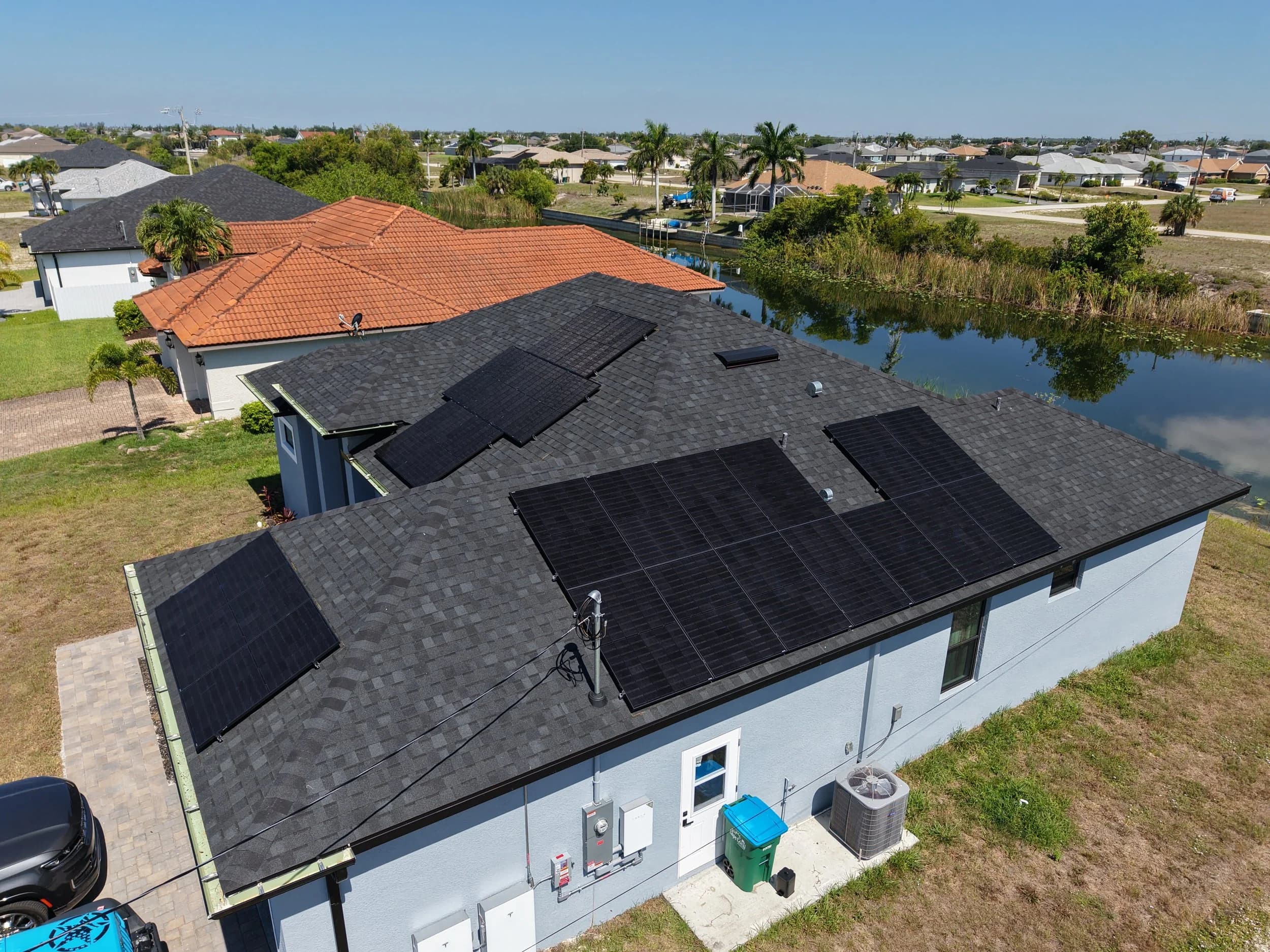 Aerial view of a Southwest Florida canal home with solar